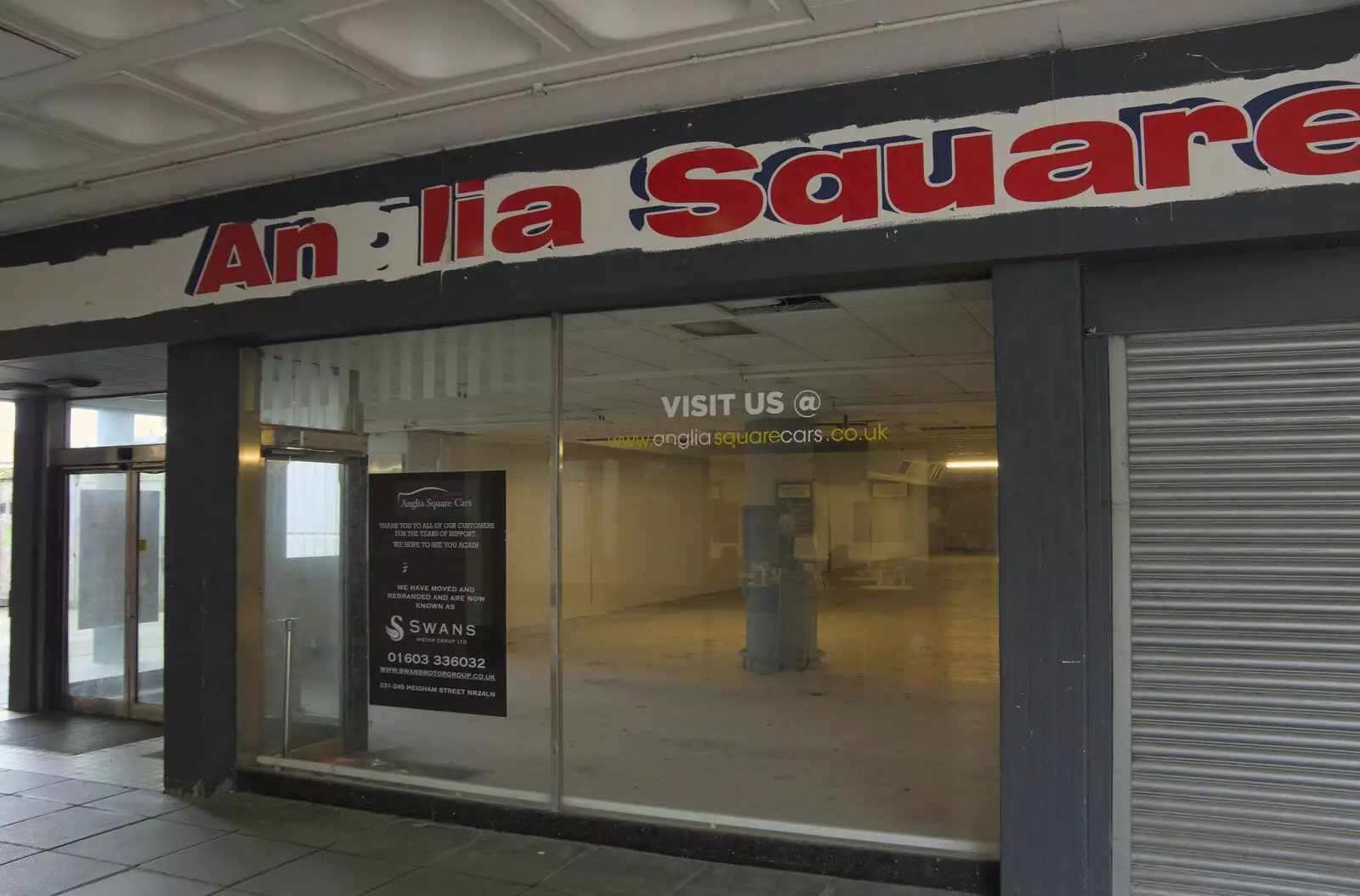 A former car showroom, and distressed sign, from The Graffiti of HMSO and Anglia Square, Coslany, Norwich - 22nd November 2023