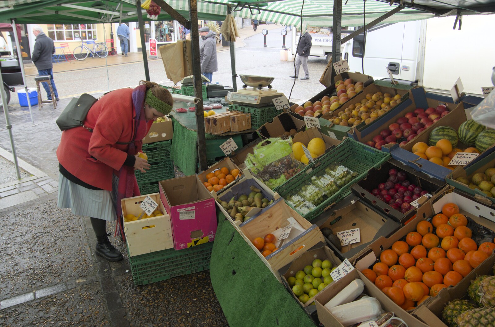 Isobel looks for fruit and veg at the market from A Long Walk Around the Airfield, Eye, Suffolk - 11th February 2024