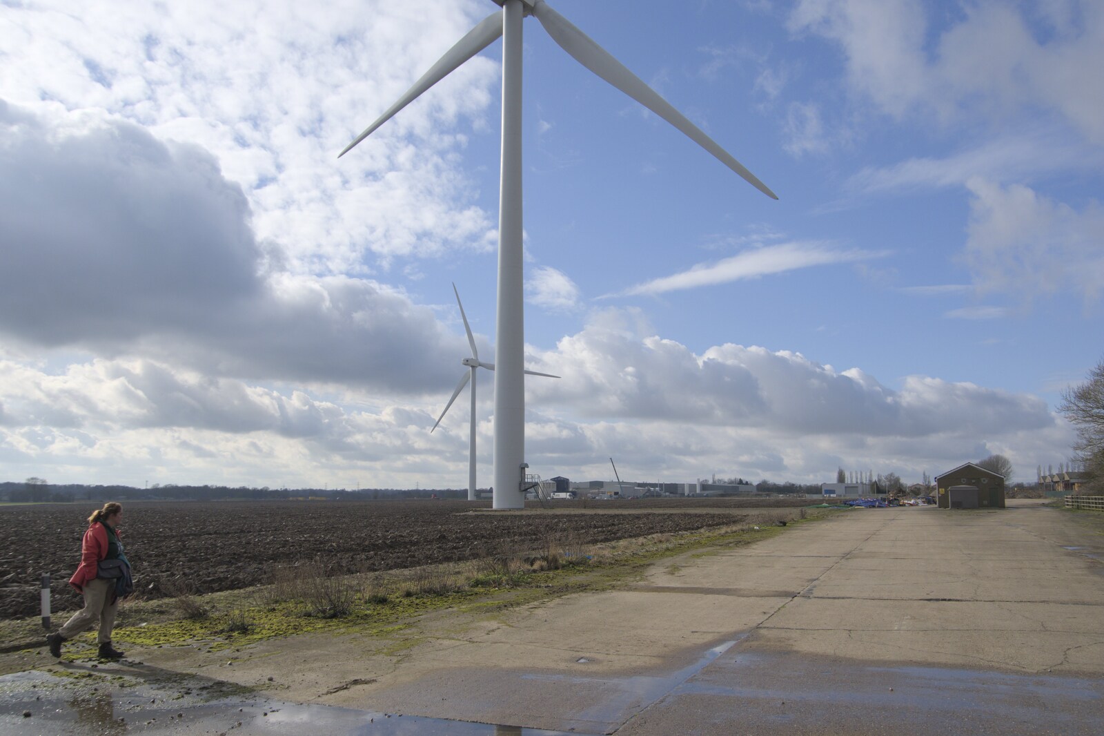 Isobel roams around near the turbines from A Long Walk Around the Airfield, Eye, Suffolk - 11th February 2024