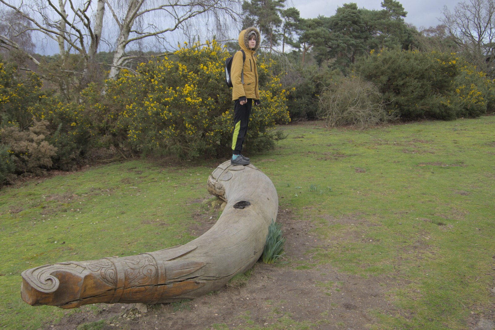 Harry stands on a cool carved tree trunk from Riddlequest at Sutton Hoo, Woodbridge, Suffolk - 23rd February 2024