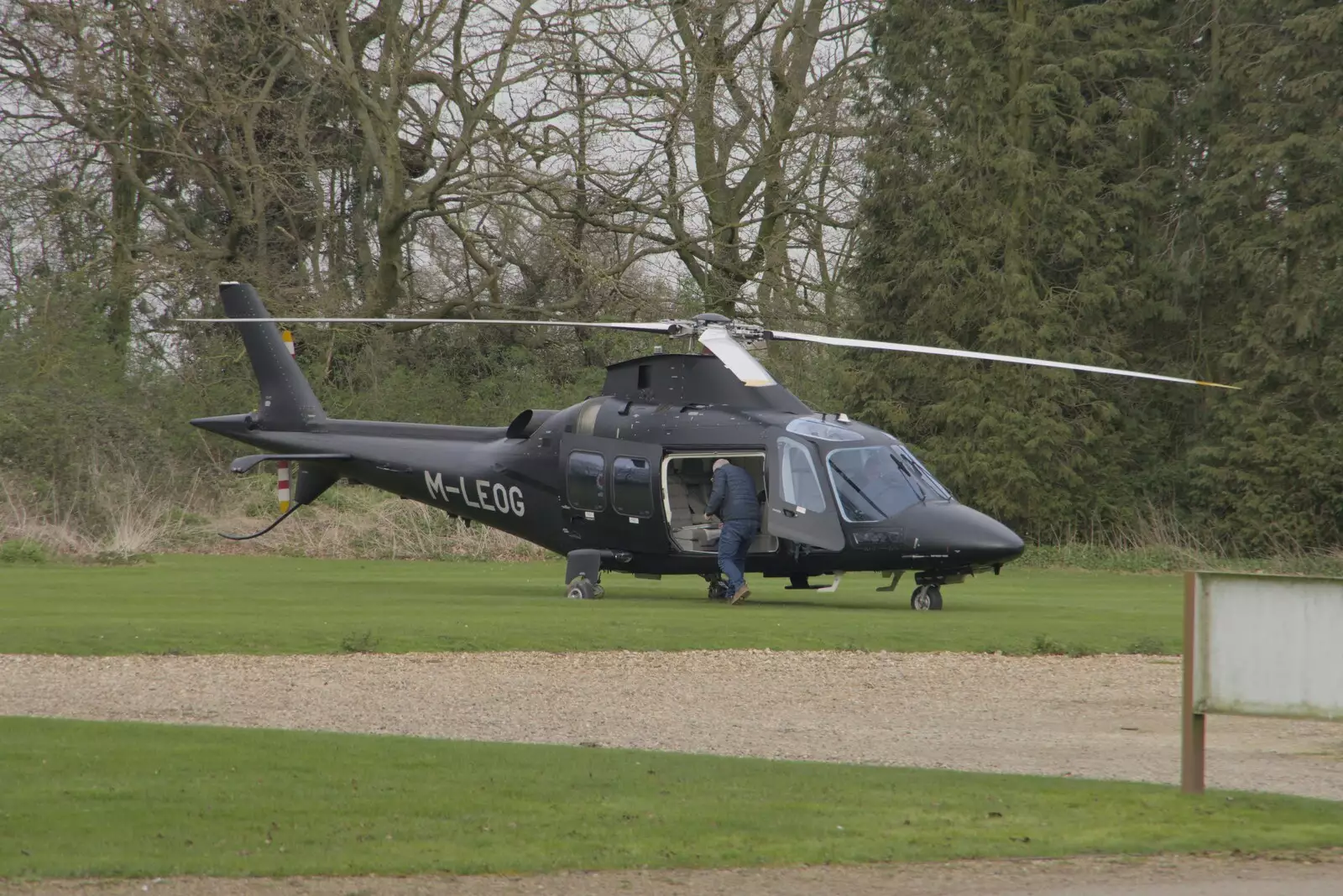 A helicopter from the Isle of Man lands at the Oaksmere, from A Cricket Quiz, and a Postcard from Colchester, Essex - 25th March 2024