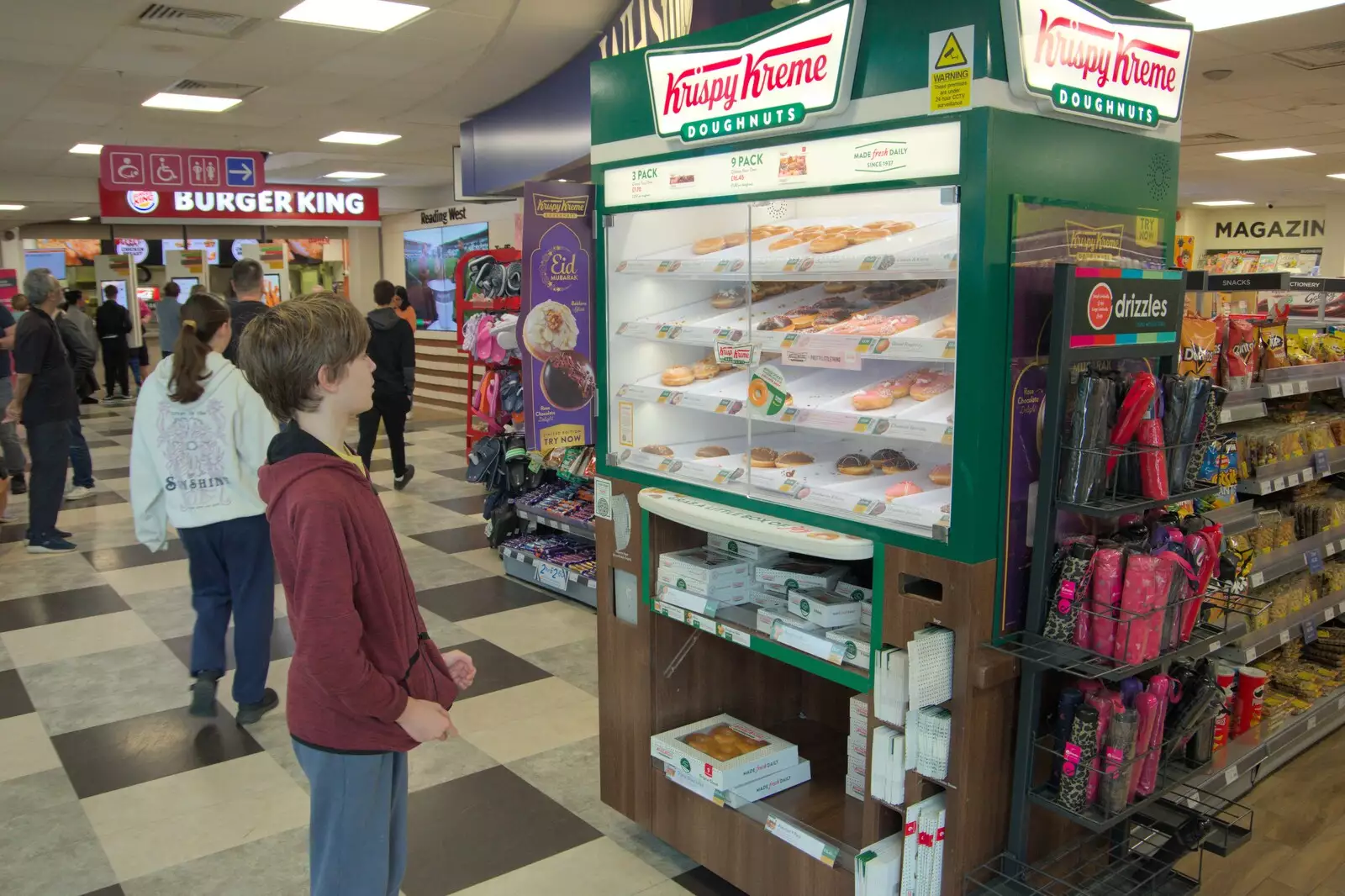 Harry looks longingly at doughnuts at Reading West, from A Postcard from Marlborough and a Walk on the Herepath, Avebury, Wiltshire - 8th April 2024