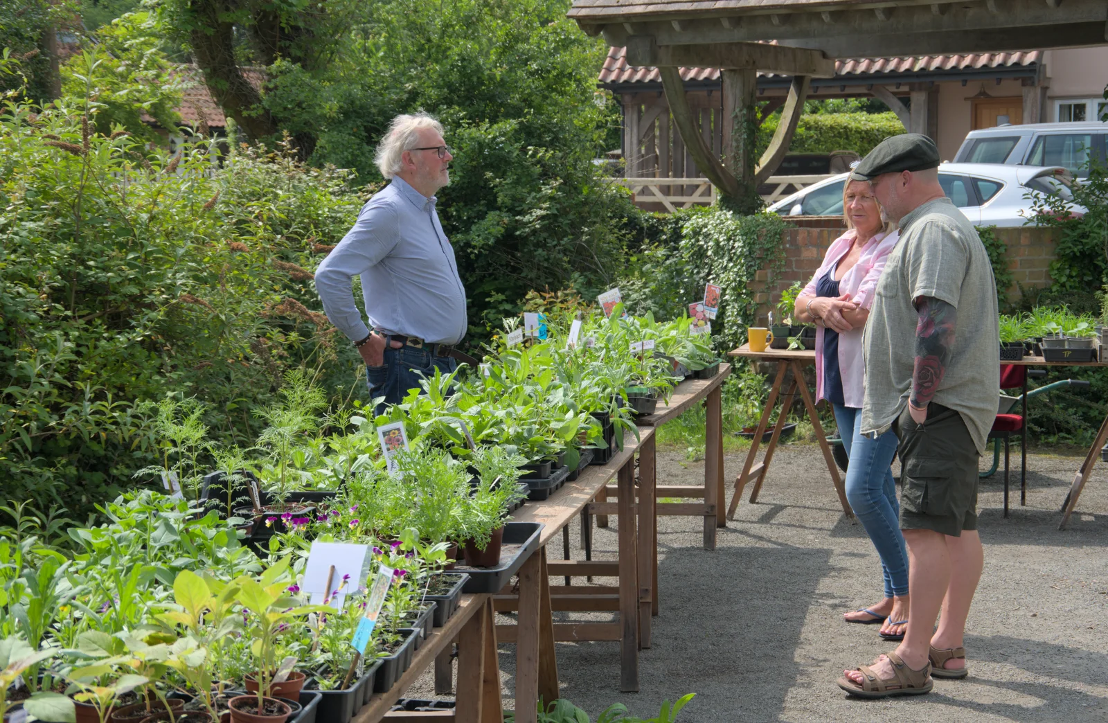 Tim looks out from behind a table of plants, from The Village Hall Plant Sale, and a New Dinghy, Weybread, Norfolk - 19th May 2024