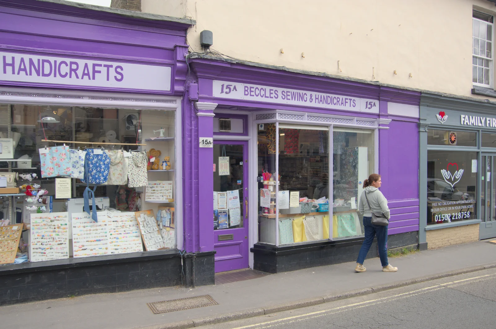 Isobel mooches past Beccles Sewing and Handicrafts, from A Trip to Beccles, and the BSCC at The Greyhound, Botesdale, Suffolk - 23rd May 2024