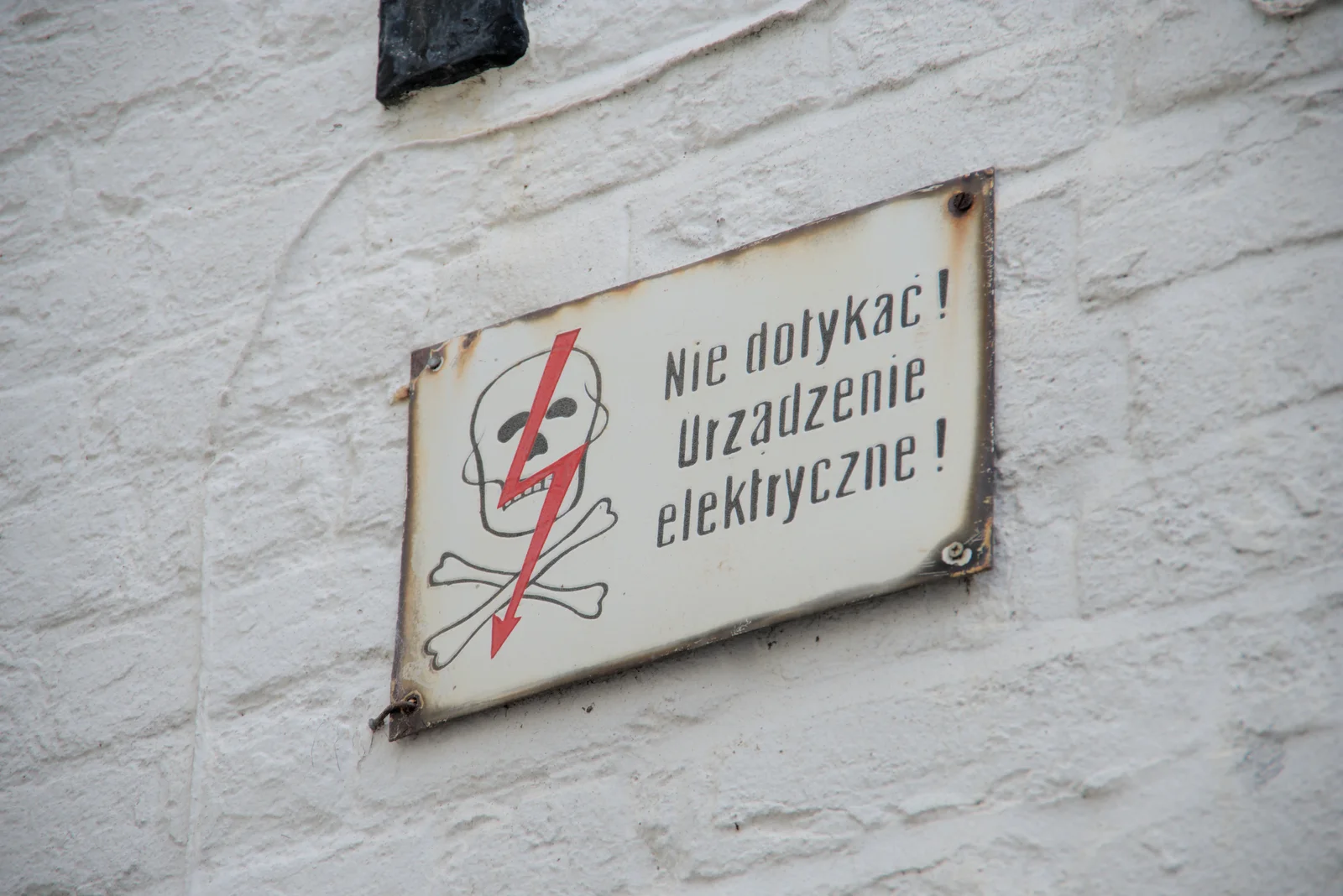 A curious electrical warning sign in Polish, from A Trip to Beccles, and the BSCC at The Greyhound, Botesdale, Suffolk - 23rd May 2024