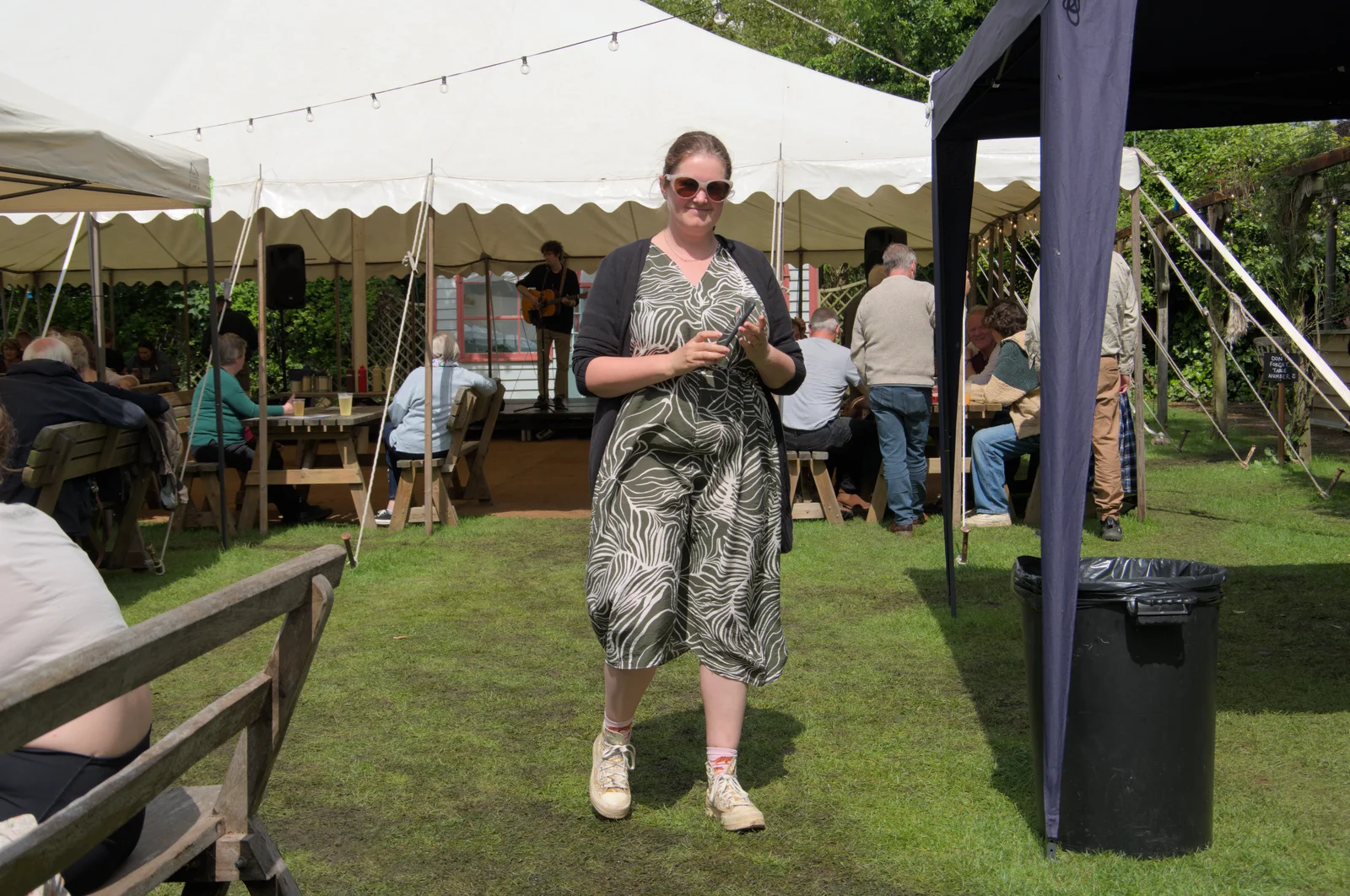 Isobel returns from a food order, from LowFest at the Low House, Laxfield, Suffolk - 26th May 2024