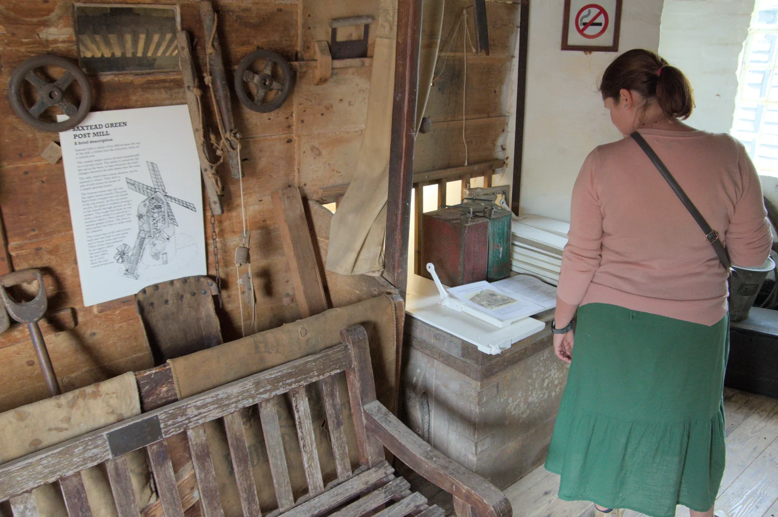 Isobel looks at stuff in the mill, from Saxtead Mill, Framlingham Gala and Chips on the Beach, Aldeburgh - 27th May 2024