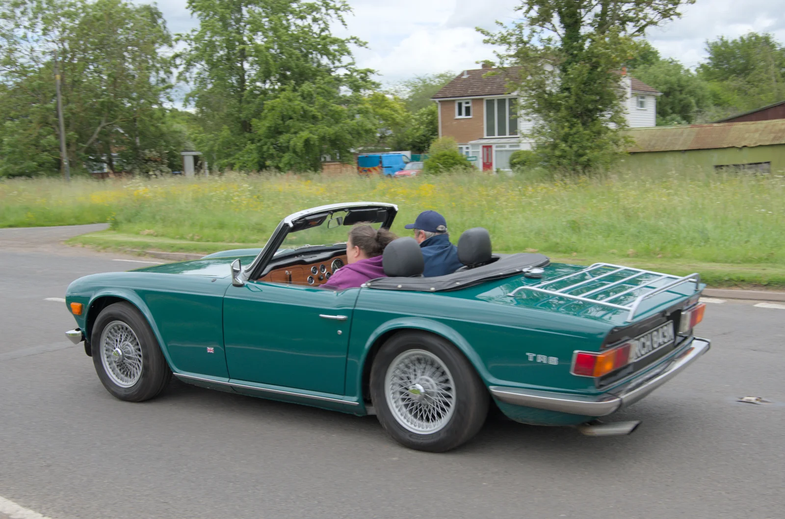 A TR6 roars off towards Yoxford, from Saxtead Mill, Framlingham Gala and Chips on the Beach, Aldeburgh - 27th May 2024