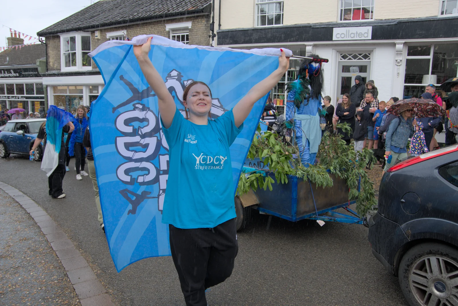 A dancer celebrates the 'Great British weather', from Saxtead Mill, Framlingham Gala and Chips on the Beach, Aldeburgh - 27th May 2024