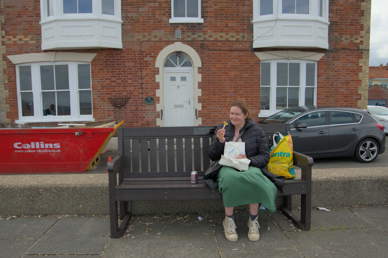 Isobel scoffs a cheeky chip on the seafront, from Saxtead Mill, Framlingham Gala and Chips on the Beach, Aldeburgh - 27th May 2024