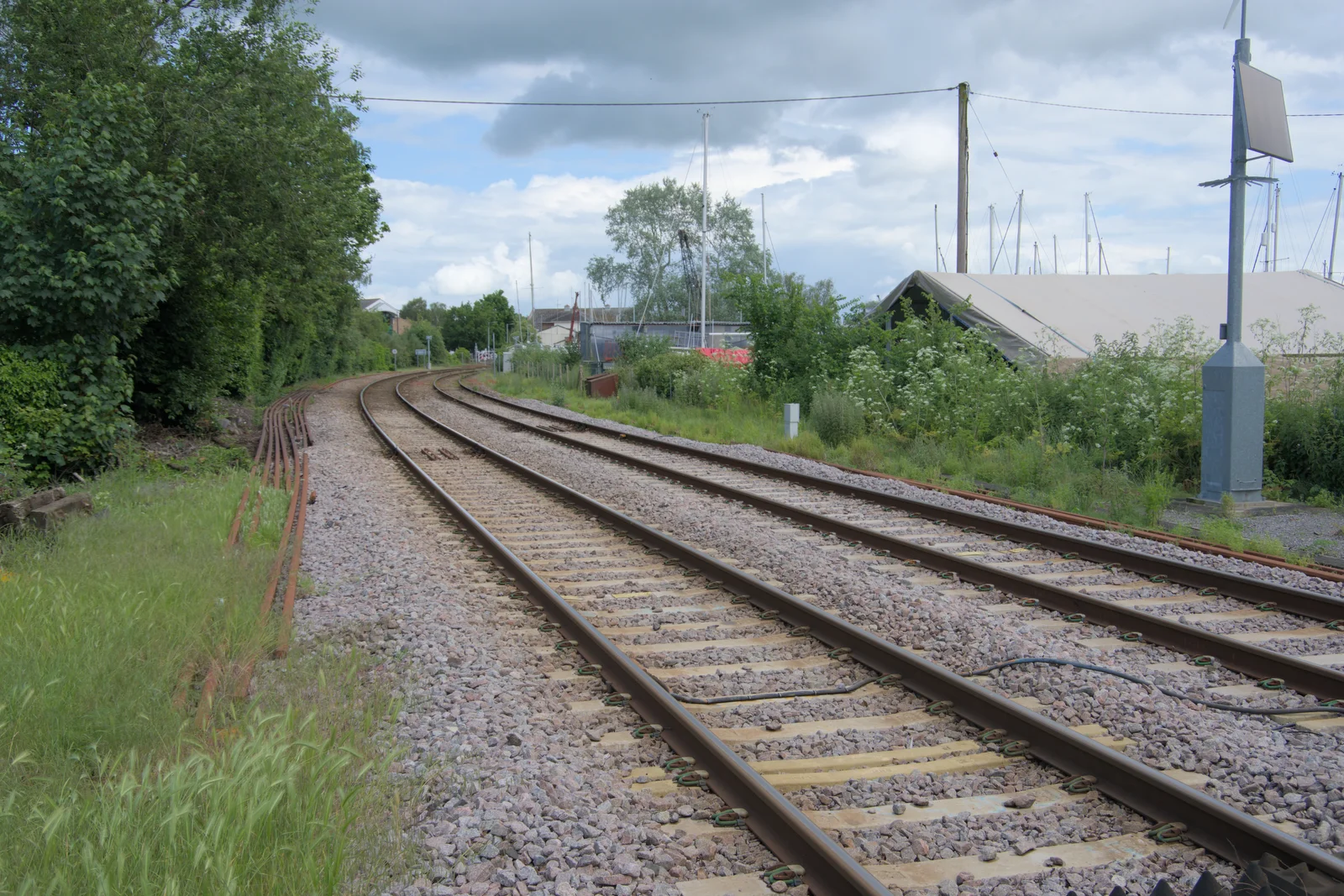 We walk across the railway tracks, from The Sutton Hoo Ship Reconstruction, The Longshed, Woodbridge - 29th May 2024