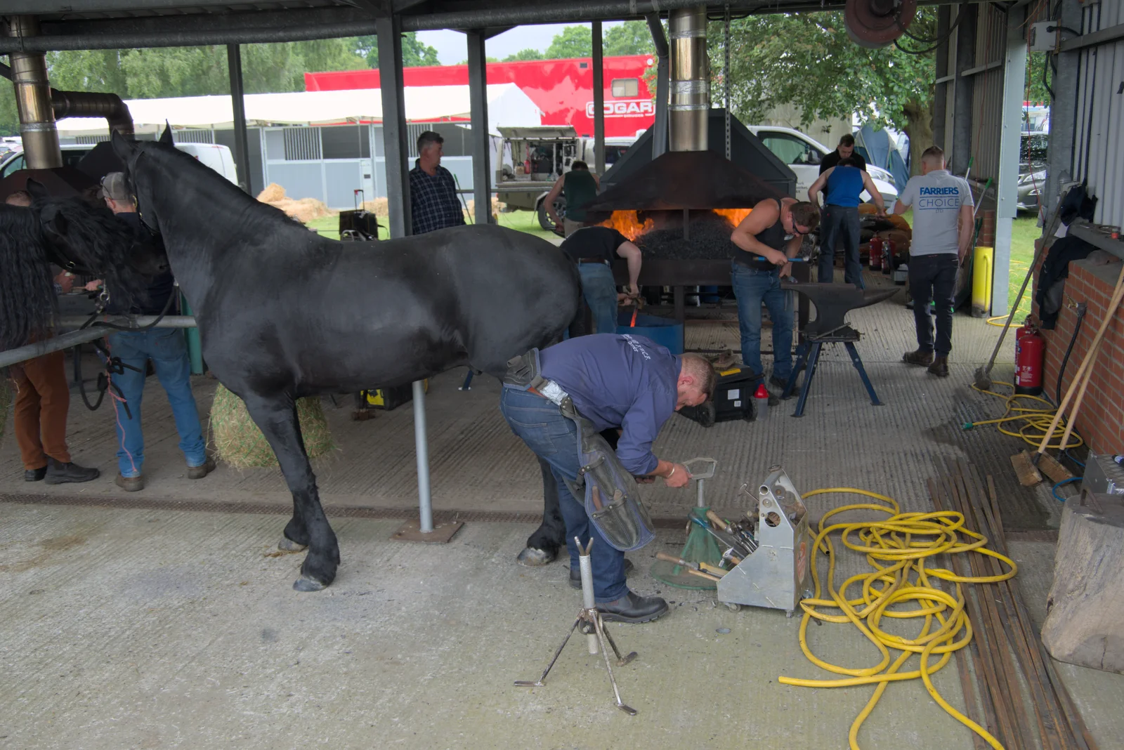 A farrier shoes a horse, from Fred and the SYWO at the Suffolk Show, Trinity Park, Ipswich - 30th May 2024