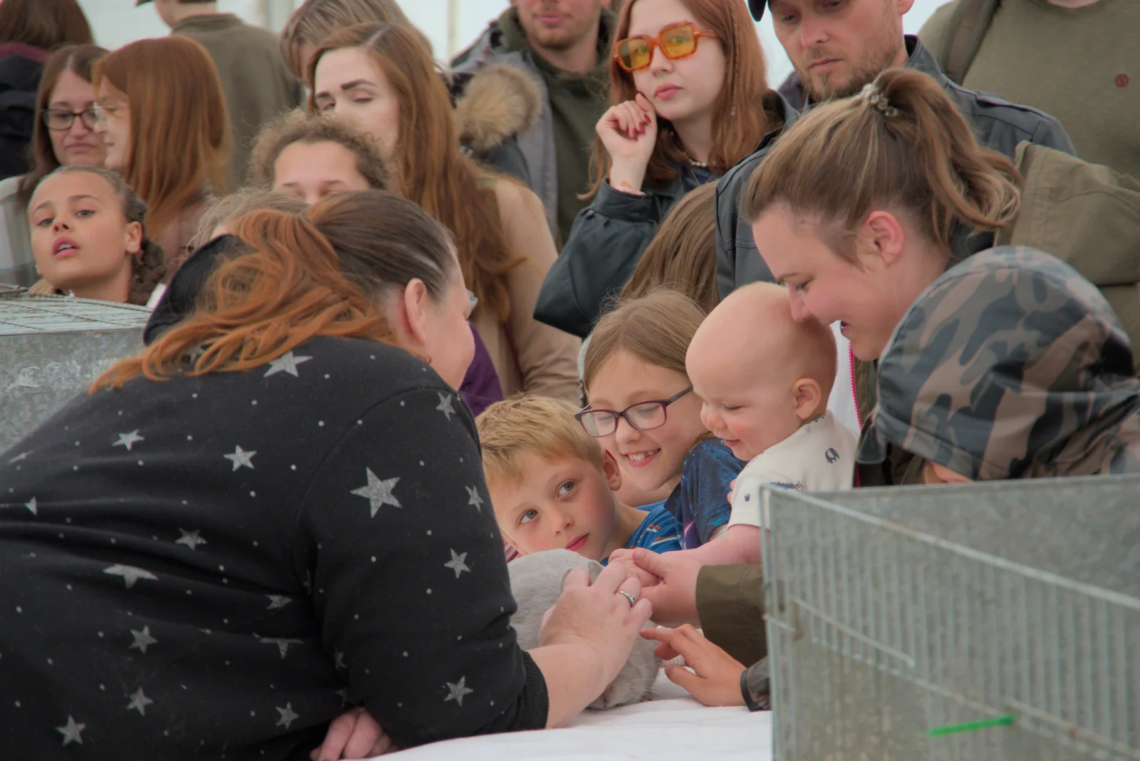 A baby gets a go of a rabbit, from Fred and the SYWO at the Suffolk Show, Trinity Park, Ipswich - 30th May 2024