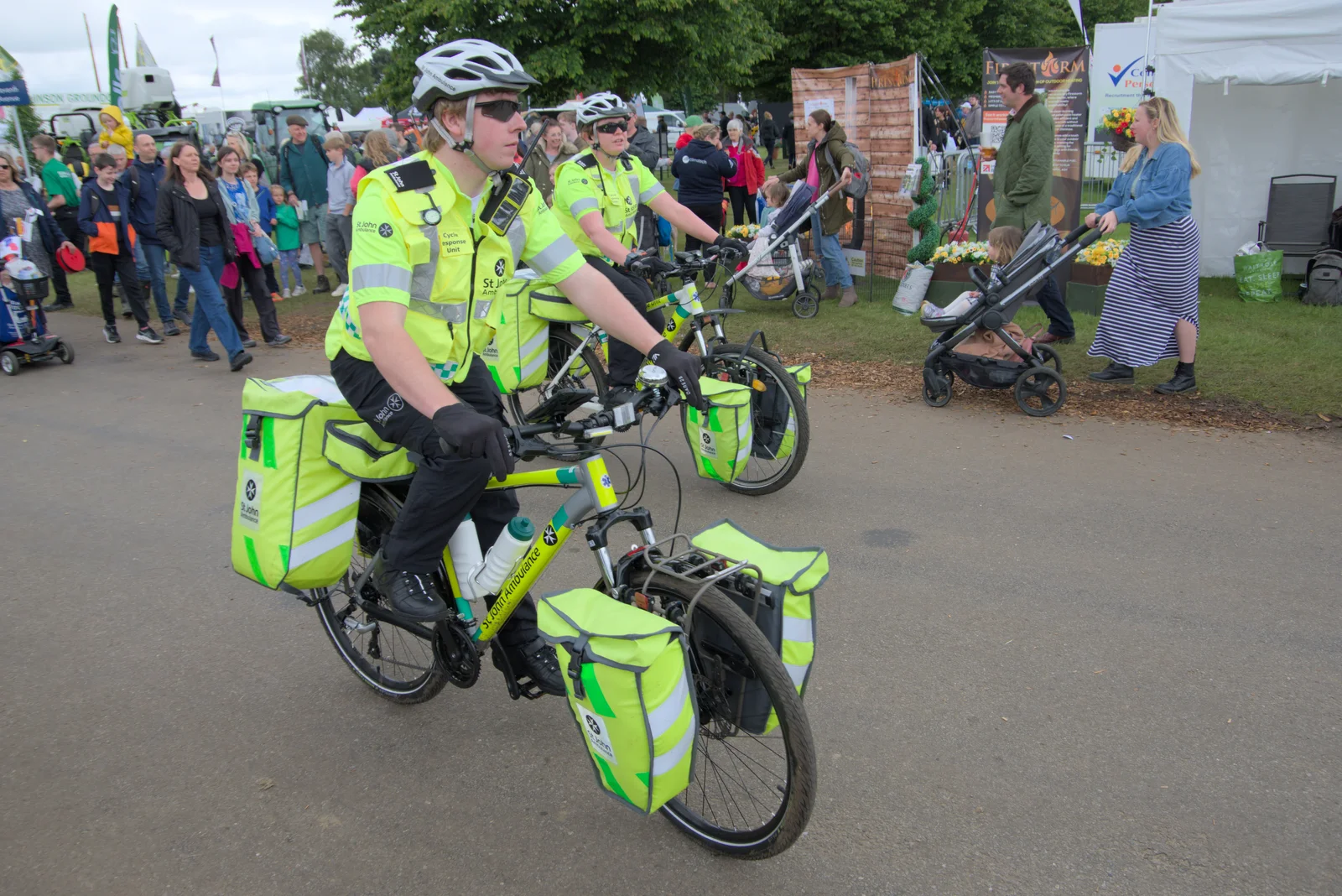 A pair of St. John Ambulance riders follow along, from Fred and the SYWO at the Suffolk Show, Trinity Park, Ipswich - 30th May 2024