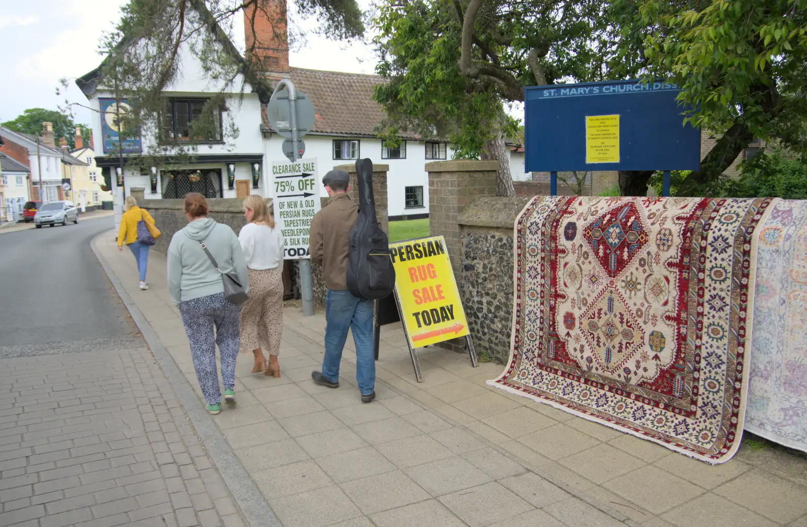 We head off past a Persian rug sale, from A "Once" Photoshoot, Diss, Norfolk - 8th June 2024