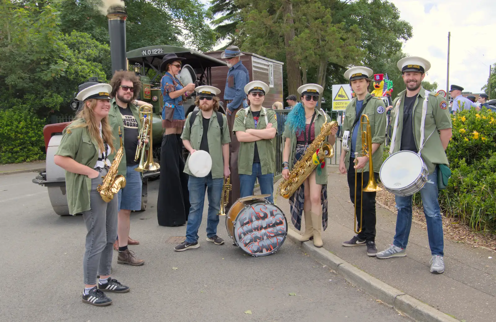 East Angles Brass Band pause for a photo, from The Carnival Procession, Diss, Norfolk - 16th June 2024