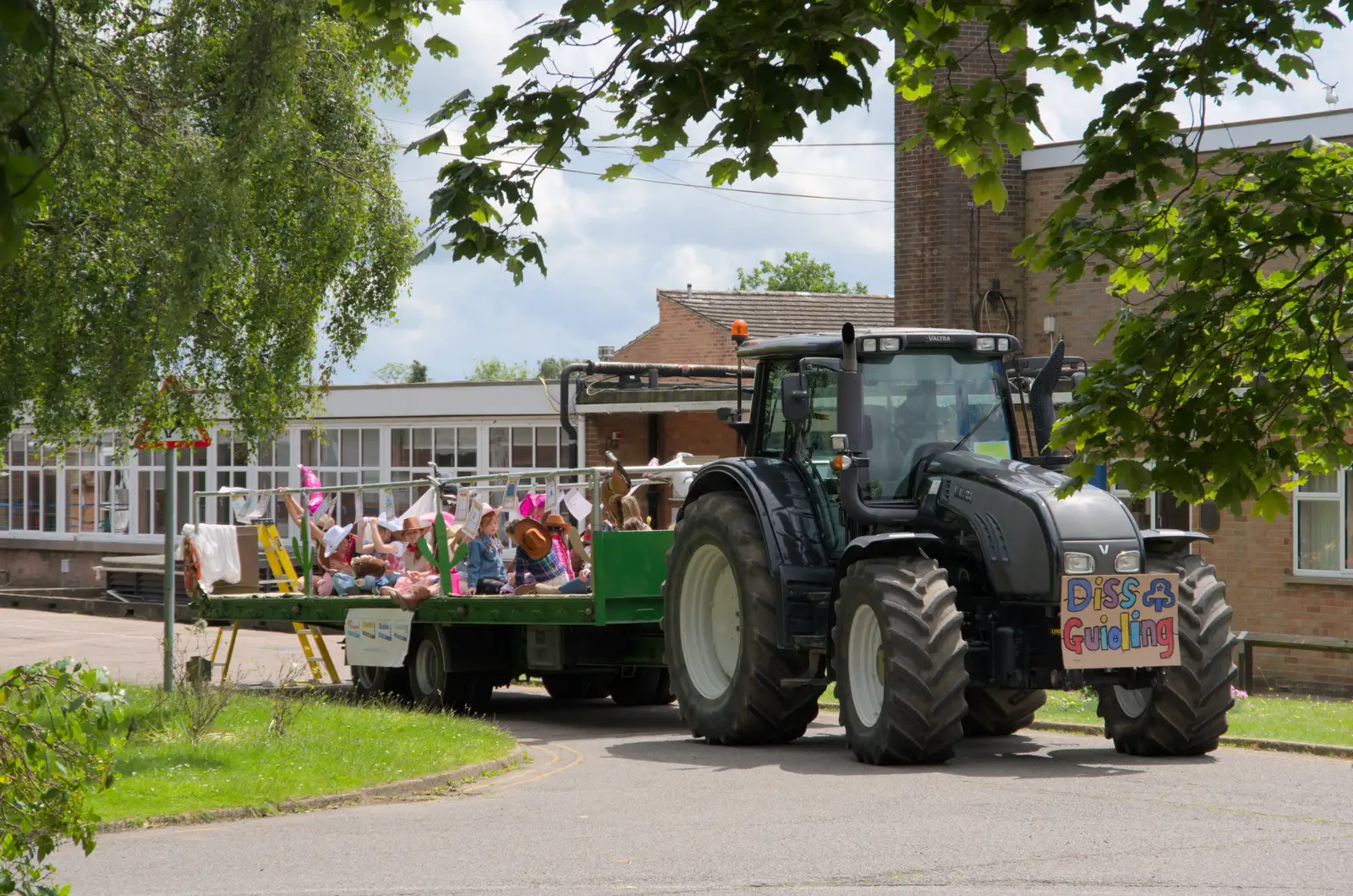 A tractor and trailer outside Diss High School, from The Carnival Procession, Diss, Norfolk - 16th June 2024