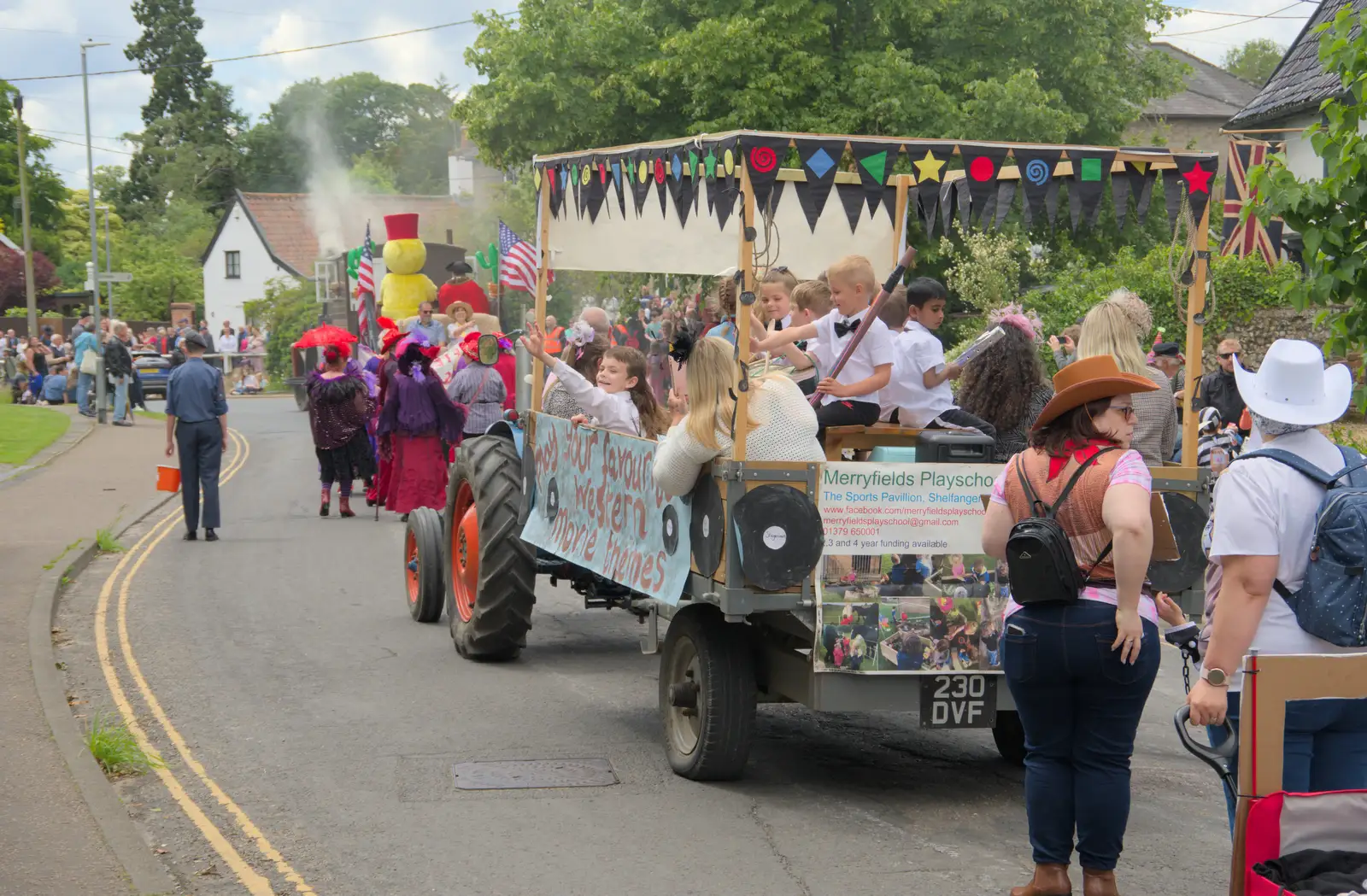 The parade continues down to Mount Street, from The Carnival Procession, Diss, Norfolk - 16th June 2024