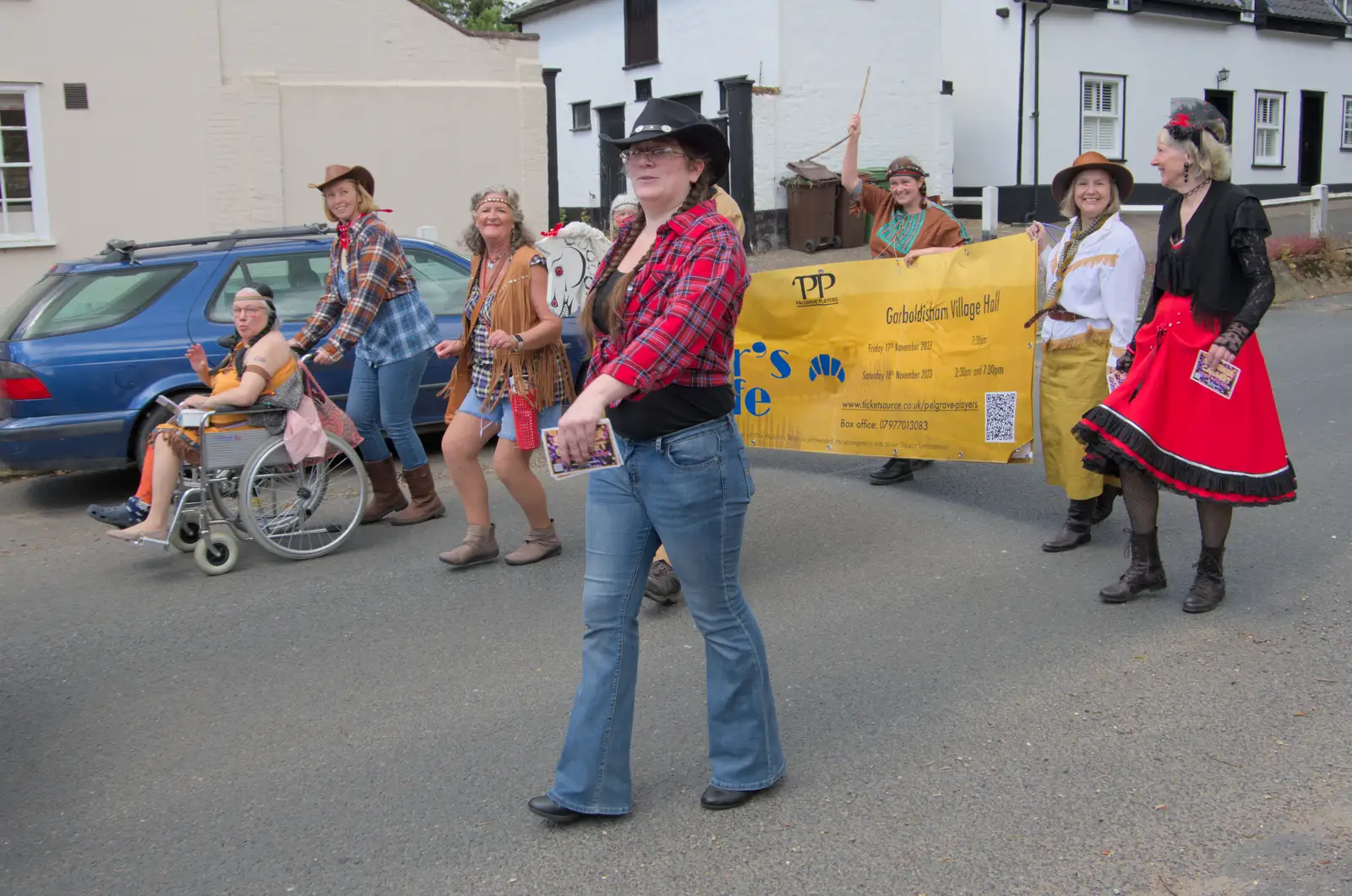 Isobel helps hold the banner up, from The Carnival Procession, Diss, Norfolk - 16th June 2024