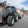 A giant tractor pulls the Diss Guiding float, The Carnival Procession, Diss, Norfolk - 16th June 2024