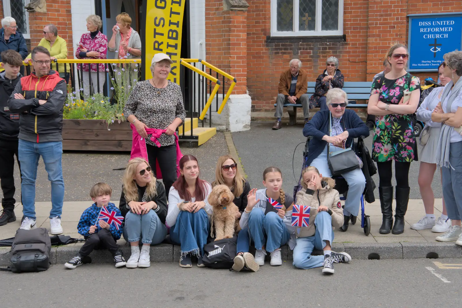 A bit of kerbside flag waving occurs, from The Carnival Procession, Diss, Norfolk - 16th June 2024