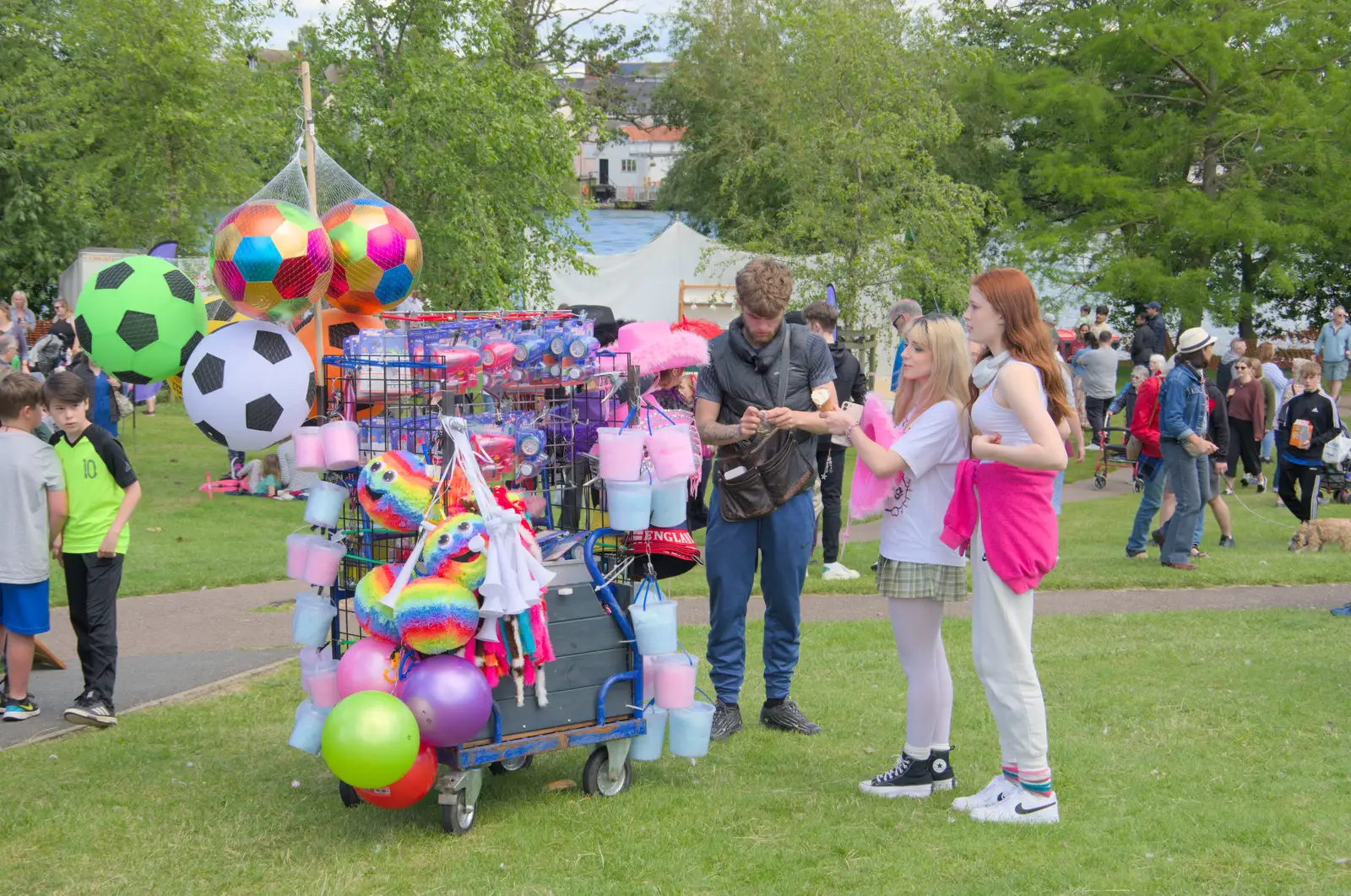 A tat-seller sells stuff, from The Carnival Procession, Diss, Norfolk - 16th June 2024