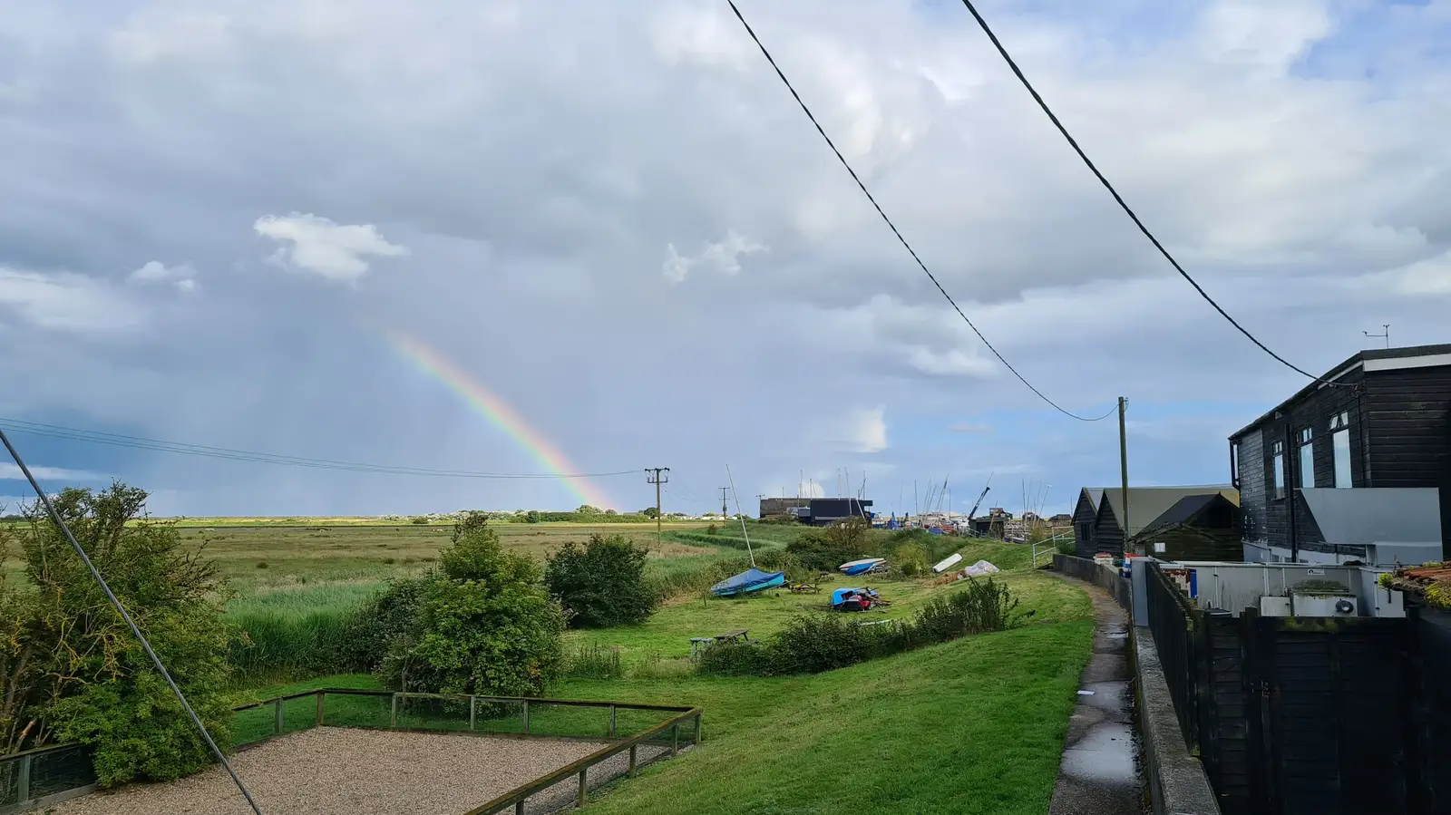 There's a small rainbow over Southwold, from Eye Karate Kamp, Southwold Harbour, Suffolk - 6th July 2024