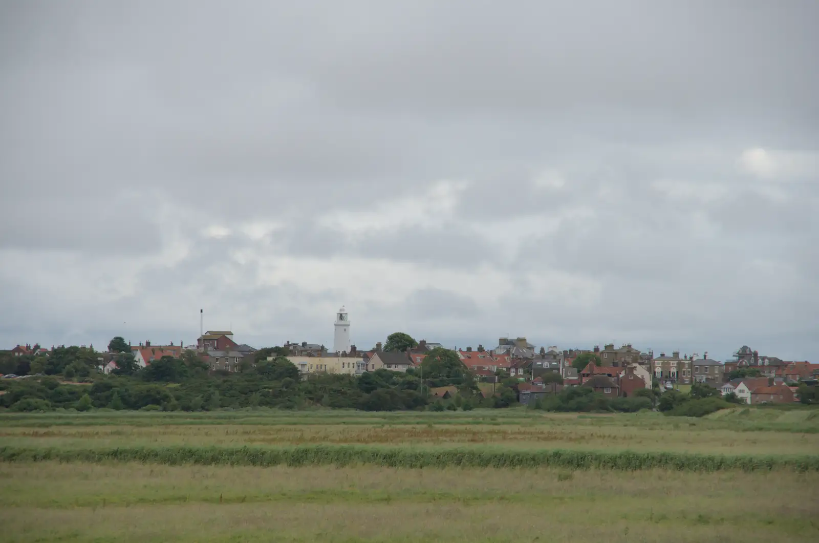 A view of Southwold lighthouse over the marshes, from Eye Karate Kamp, Southwold Harbour, Suffolk - 6th July 2024