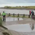 A couple of cyclists roar past, Eye Karate Kamp, Southwold Harbour, Suffolk - 6th July 2024