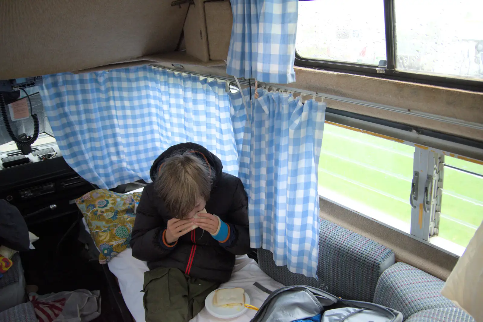 Harry scoffs a cheese sandwich in the van, from Eye Karate Kamp, Southwold Harbour, Suffolk - 6th July 2024