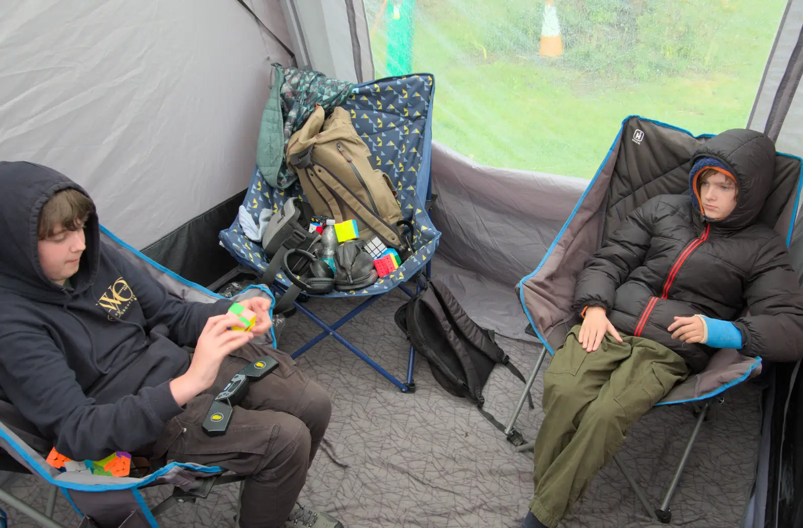 We hide out from the rain in the awning, from Eye Karate Kamp, Southwold Harbour, Suffolk - 6th July 2024