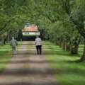 An old couple head off down Brome Hall's drive, The Brome and Oakley Village Fête, Brome Hall, Suffolk - 13th July 2024