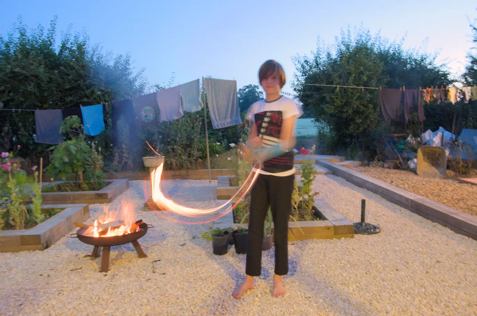 Harry waves a burning stick around, from Isobel's Relatives Visit, Brome, Suffolk - 20th July 2024