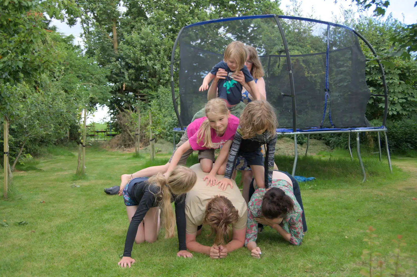 The gang make a human pyramid, from Isobel's Relatives Visit, Brome, Suffolk - 20th July 2024