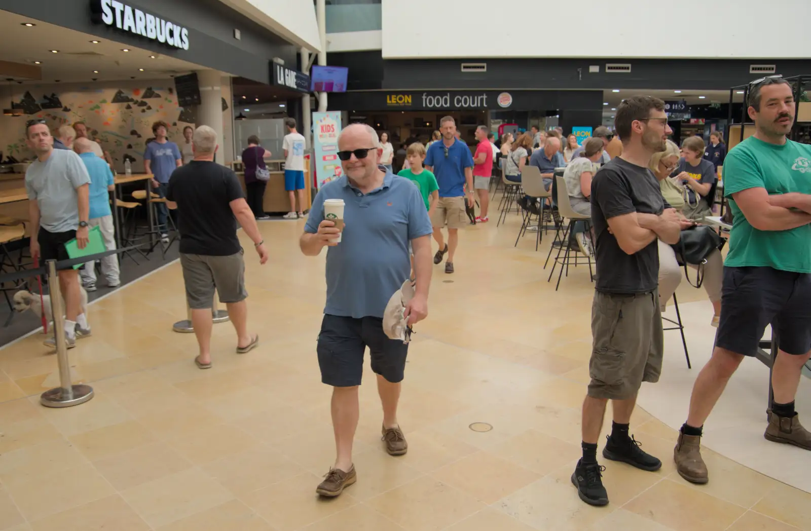 Hamish roams around with a coffee, from An Olympic Road Trip from Diss to Marseille, France - 3rd August 2024