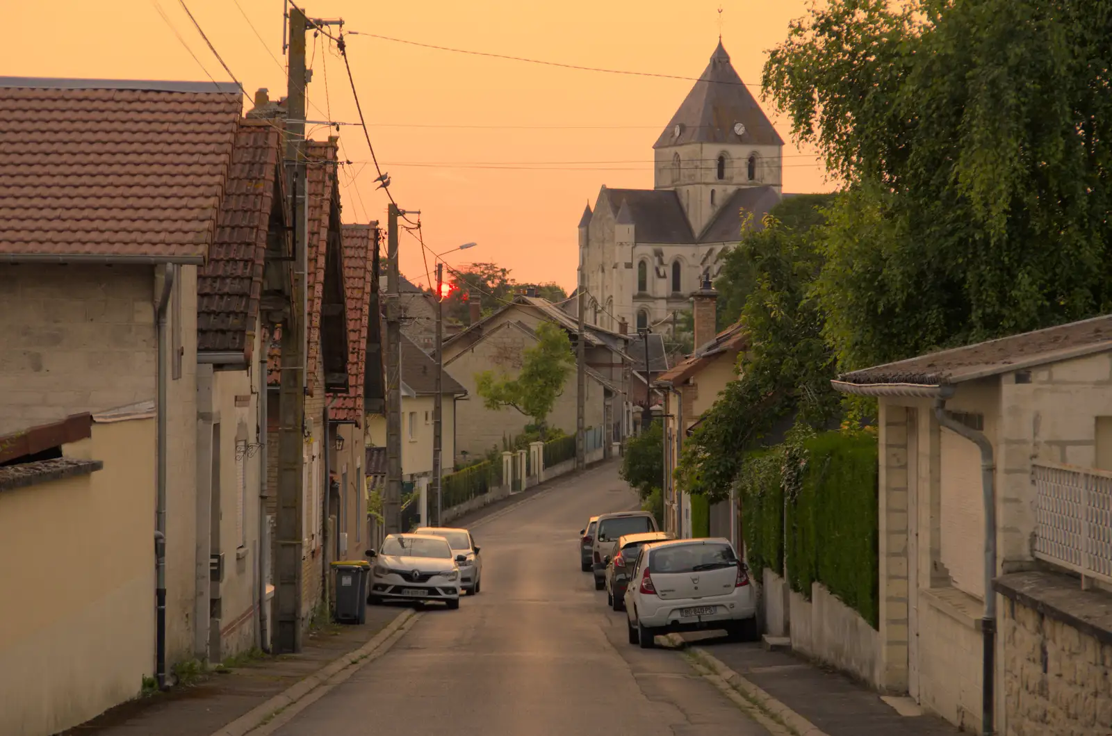 The sun sets near the Église Saint Pierre, from An Olympic Road Trip from Diss to Marseille, France - 3rd August 2024