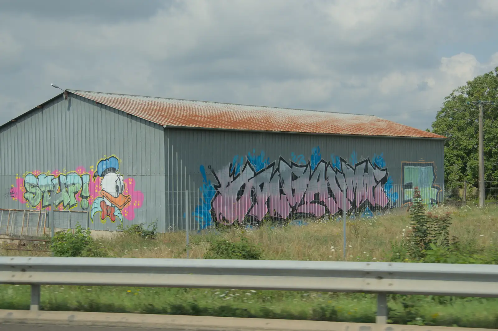 Donald Duck graffiti on a farm building, from An Olympic Road Trip from Diss to Marseille, France - 3rd August 2024