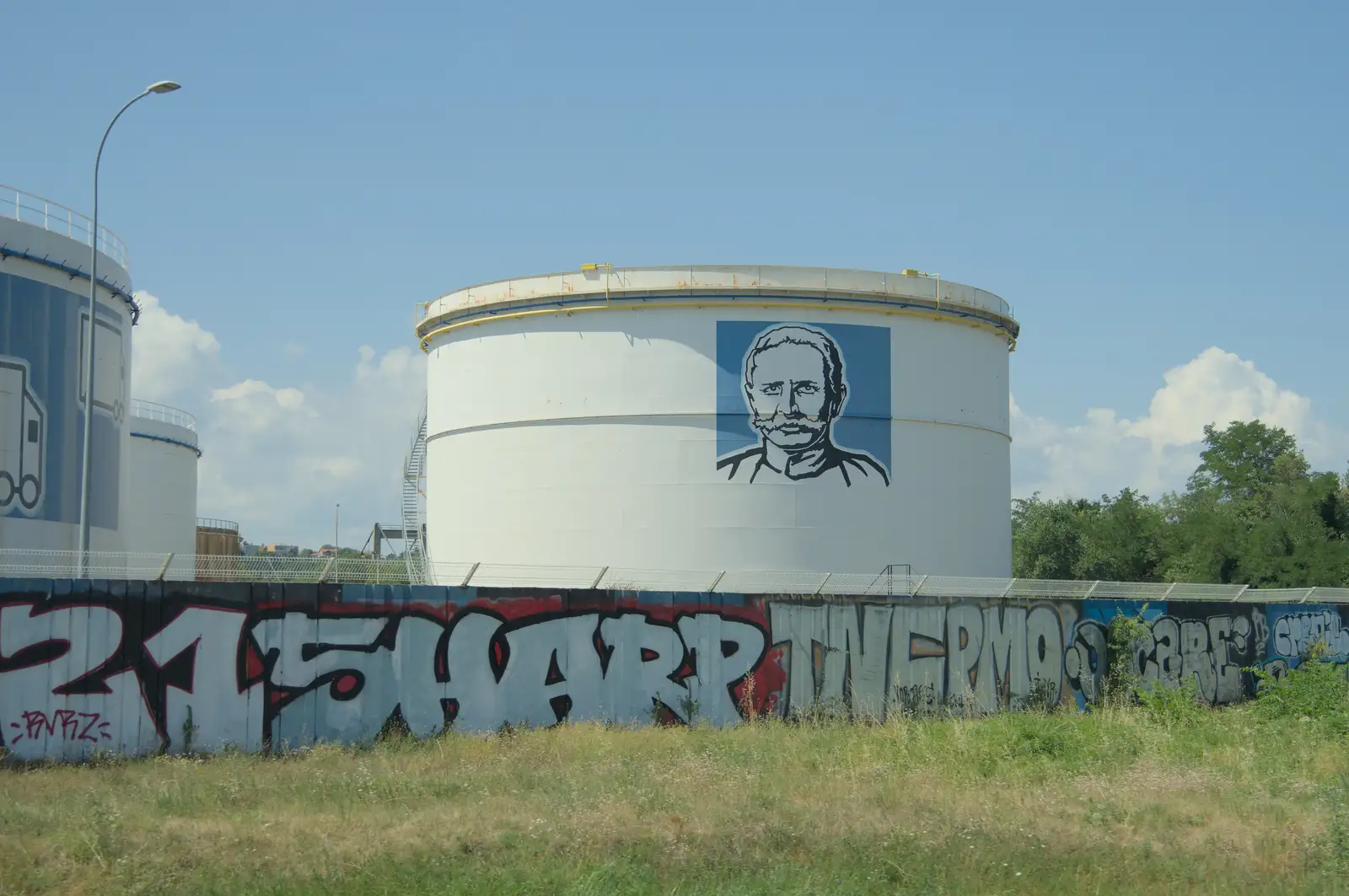 Some sort of French Colonel Sanders on an oil tank, from An Olympic Road Trip from Diss to Marseille, France - 3rd August 2024