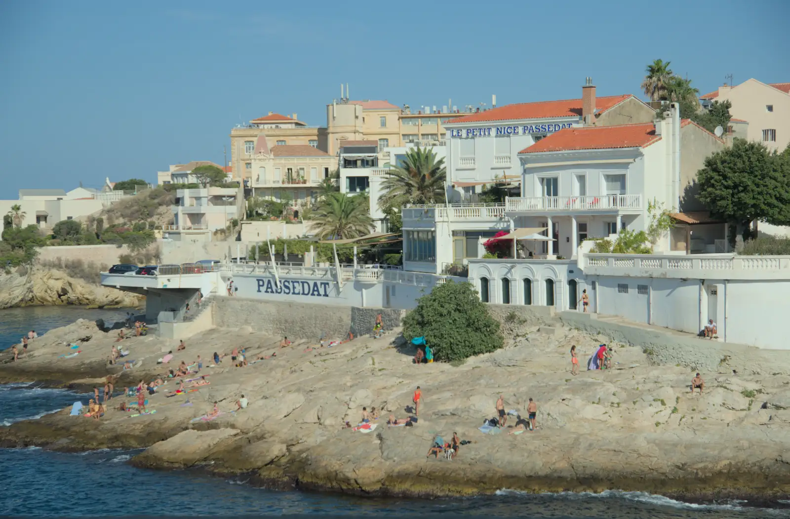 People sunbathe on the rocks, from An Olympic Road Trip from Diss to Marseille, France - 3rd August 2024