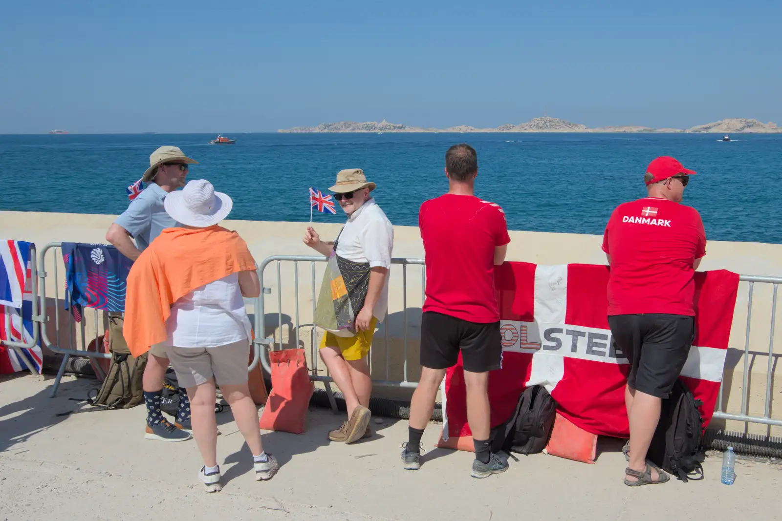 Hamish waves a flag, from Hannah and Olympic ILCA 6 Sailing, Marseille, France - 5th August 2024