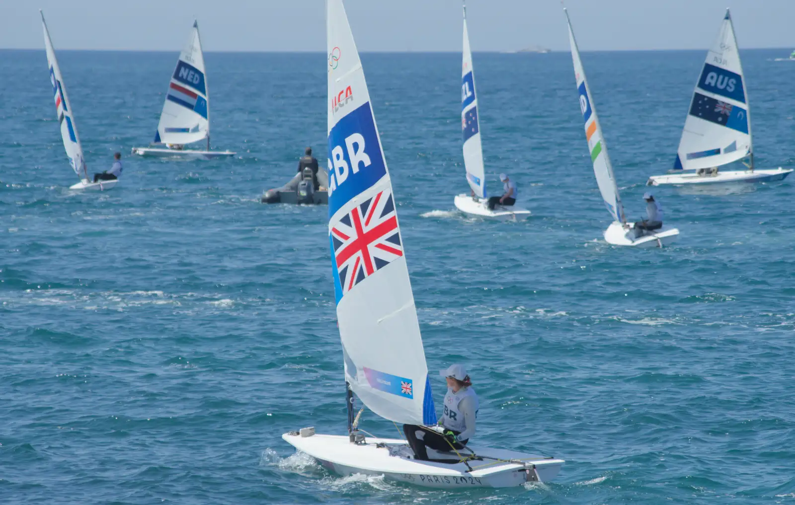 The fleet heads out to sea, from Hannah and Olympic ILCA 6 Sailing, Marseille, France - 5th August 2024