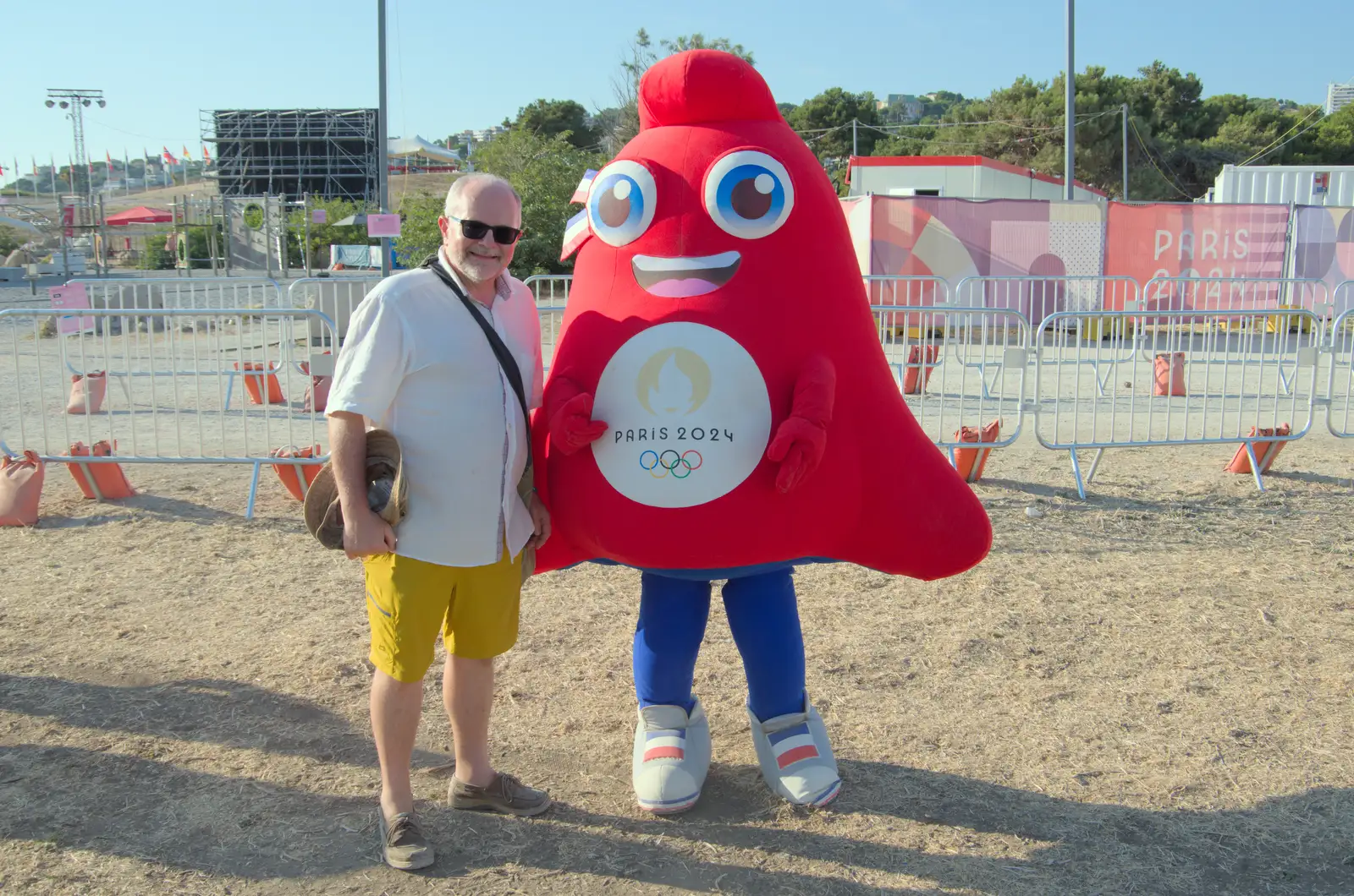 Hamish poses for a photo with the Olympic mascot, from Hannah and Olympic ILCA 6 Sailing, Marseille, France - 5th August 2024