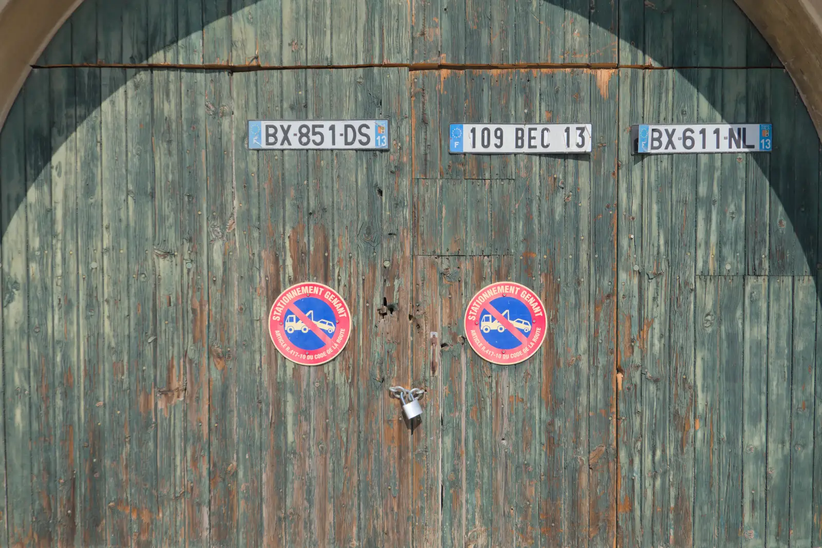 A faded green door with rescued number plates, from Olympic Non-Sailing, Notre Dame, and the Journey Home, Marseille, France - 8th August 2024