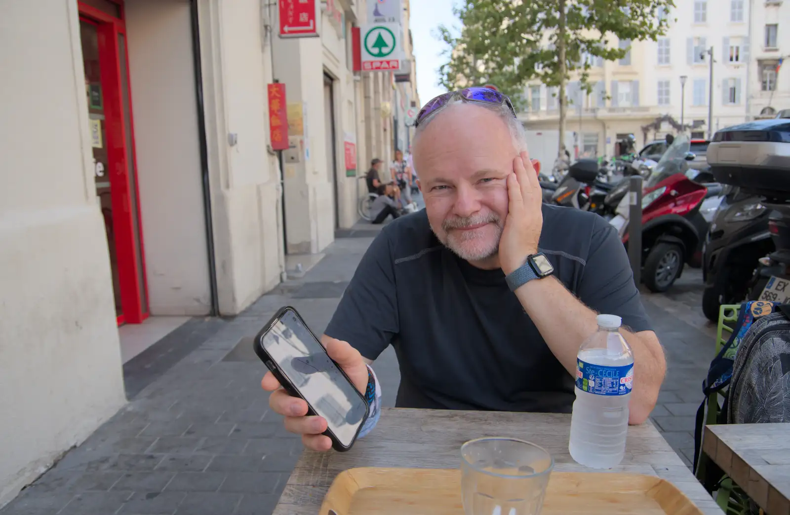 Hamish shows off something on his phone, from Olympic Non-Sailing, Notre Dame, and the Journey Home, Marseille, France - 8th August 2024