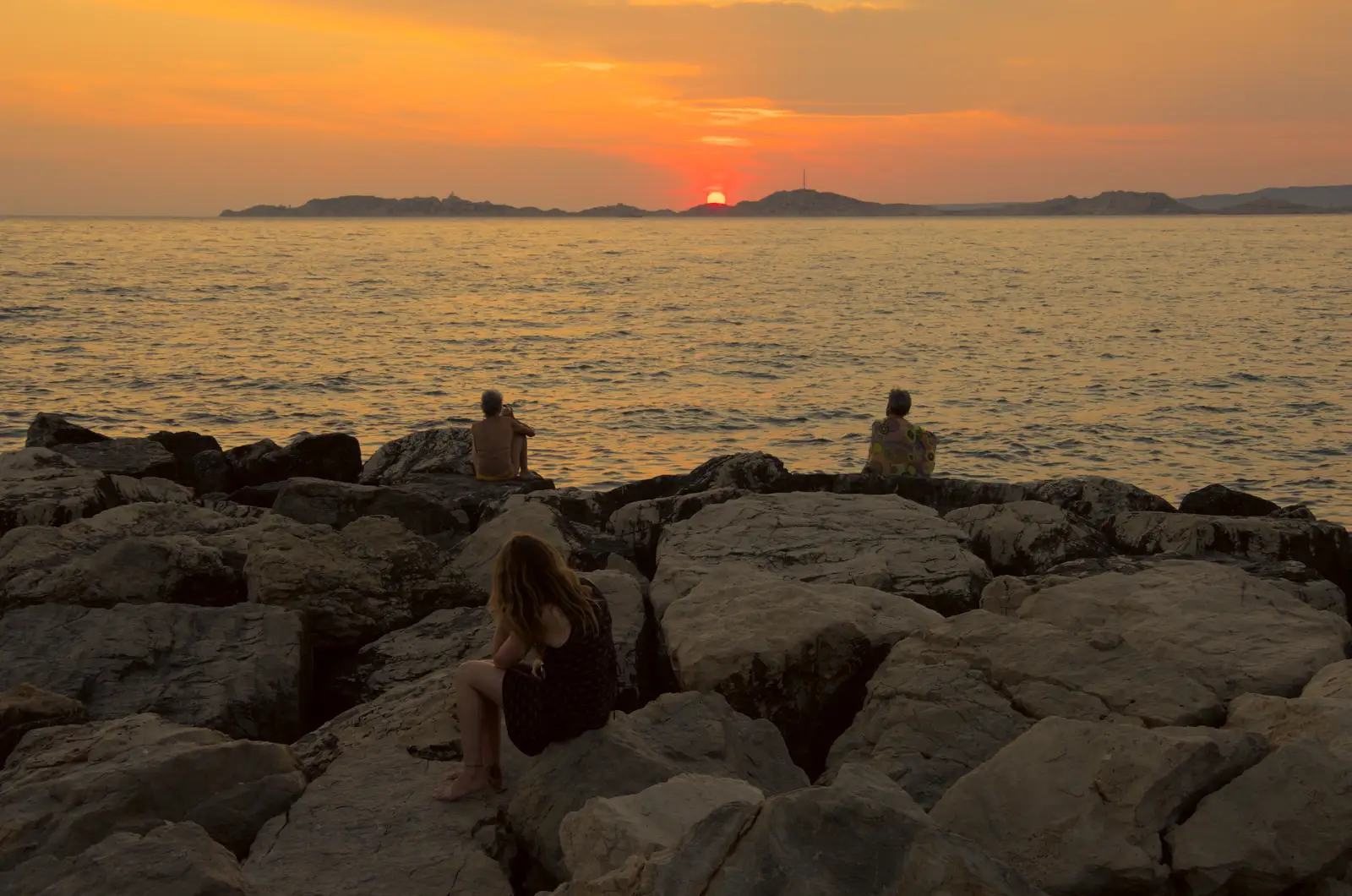 People on the rocks watch the setting sun, from Olympic Non-Sailing, Notre Dame, and the Journey Home, Marseille, France - 8th August 2024