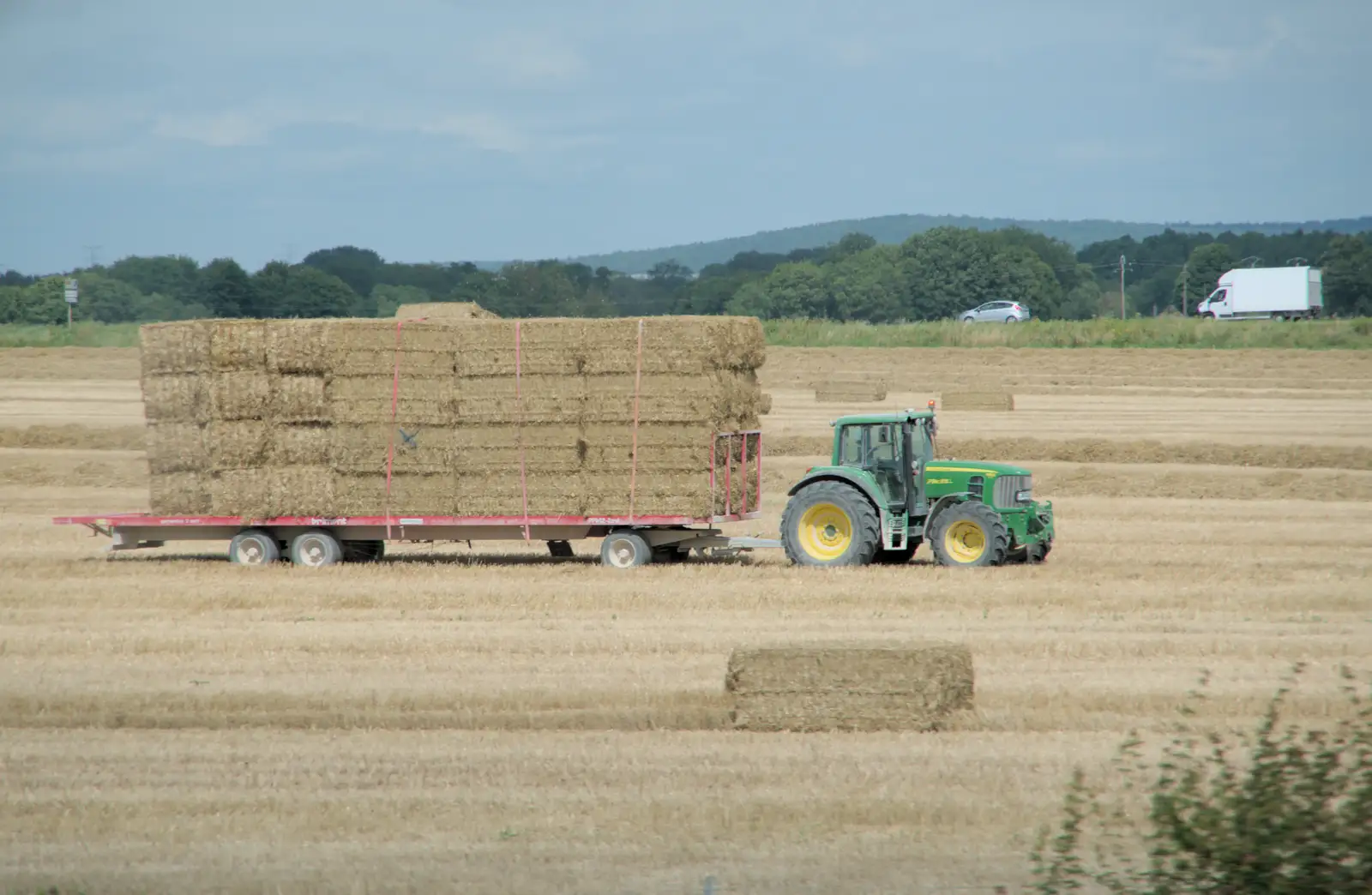 A tractor hauls around straw bales, from Olympic Non-Sailing, Notre Dame, and the Journey Home, Marseille, France - 8th August 2024