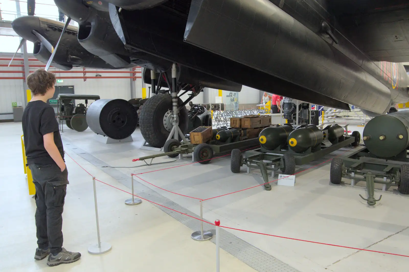 Fred looks at the payload of a Lancaster, from Flying in a Dragon Rapide, IWM Duxford, Cambridgeshire - 17th August 2024