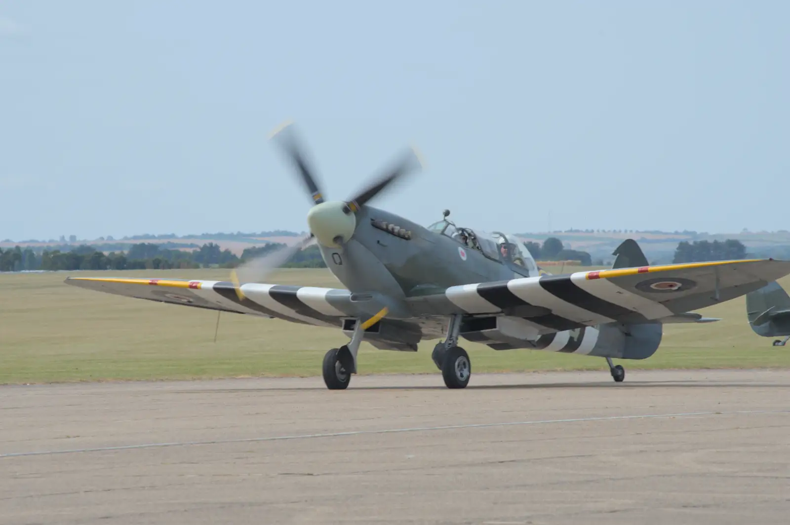 A taxiing Spitfire, from Flying in a Dragon Rapide, IWM Duxford, Cambridgeshire - 17th August 2024