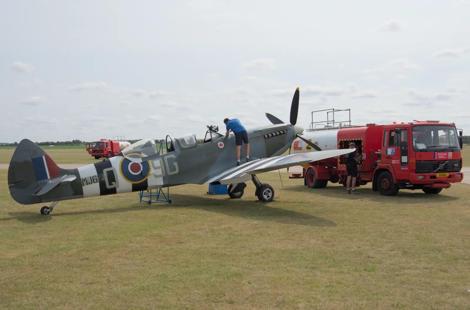 The Spitfire is refuelled, from Flying in a Dragon Rapide, IWM Duxford, Cambridgeshire - 17th August 2024