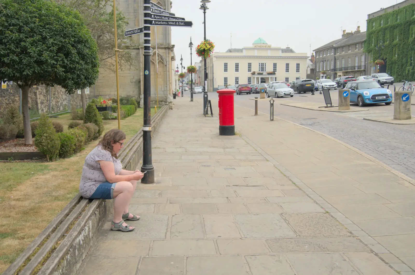 Sis checks her phone on Angel Hill, from A Trip to Ickworth House with Sis, Horringer - 19th August 2024